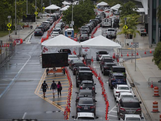 Cars are seen in line as the drivers wait to be tested for COVID-19 at a testing site located at the Miami Beach Convention Center in Miami Beach, Florida. Picture: AFP