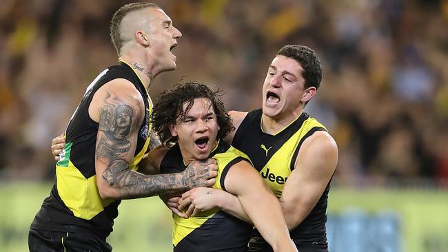 Dustin Martin, Daniel Rioli and Jason Castagna celebrate a goal. Picture: Alex Coppel