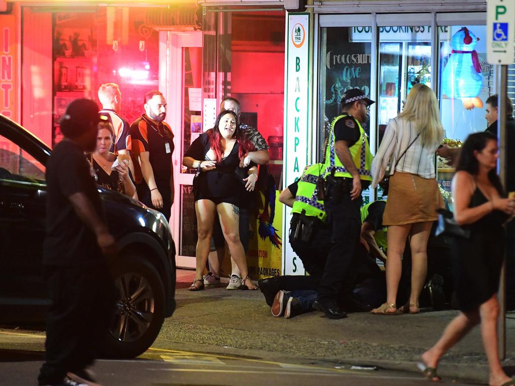 Police officers break up a fight on Mitchell street in the early hours of New Year's day