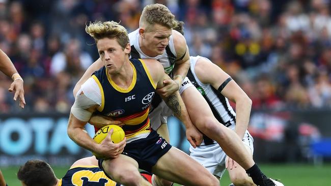 Collingwood midfielder tackles Adelaide’s Rory Sloane at Adelaide Oval. Picture: Mark Brake/Getty