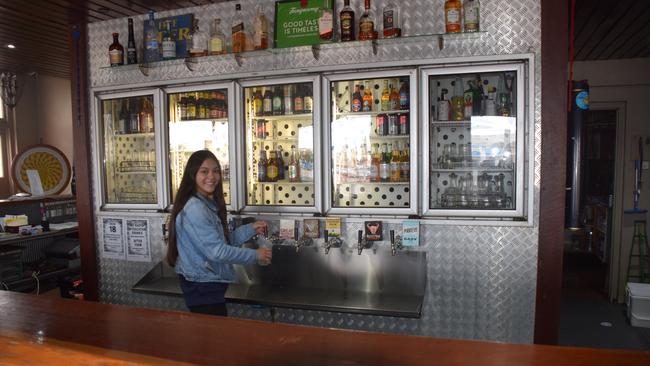 Tash Calderley will be pouring less drinks than usual at the Kingaroy Hotel this weekend thanks to new coronavirus measures. (Picture: Tristan Evert)