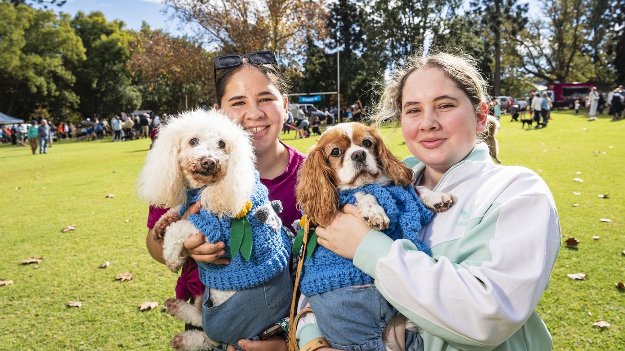 Sisters Olivia (left) and Annabelle Currie dressed Karmicheal (left) and Polly for Toowoomba's Million Paws Walk at Queens Park, Friday, May 24, 2024. Picture: Kevin Farmer