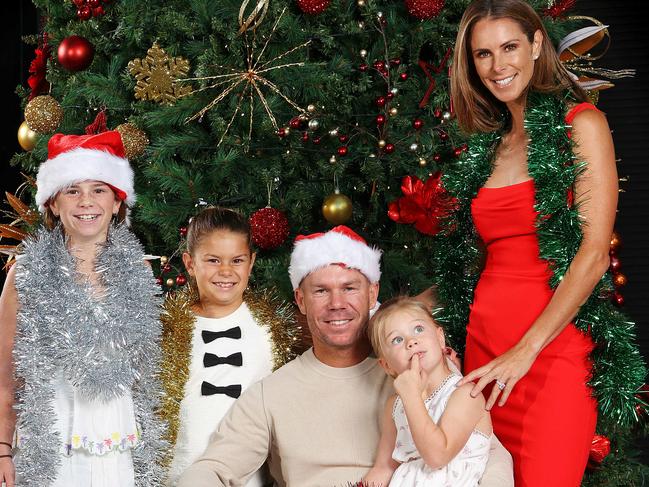 MELBOURNE, DECEMBER 23, 2023: Australian cricketer David Warner pictured with wife Candice and daughters Ivy, 9, Indi, 7, and Isla, 4, ahead of the 2023 Boxing Day Test. Picture: Mark Stewart