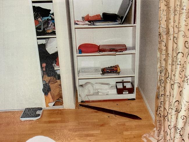 A crime scene photo shows the murder weapon, an artificial decking plank fashioned into a sword.