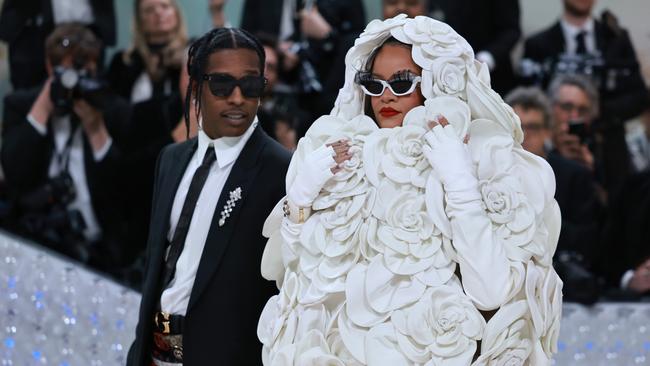 Rihanna, in a dramatic white Maison Valentino gown, arrives with A$AP Rocky. Picture: Getty Images for Karl Lagerfeld