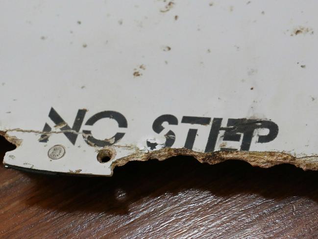 (FILES) This file photo taken on March 3, 2016 shows a piece of suspected aircraft wreckage found off the east African coast of Mozambique at Mozambique's Civil Aviation Institute (IACM) in Maputo. Two pieces of debris found in Mozambique are 