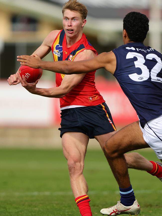 Draper handballs under pressure for South Australia against Victoria Metro at the AFL under-18 championships. Picture: Sarah Reed/AFL Photos via Getty Images