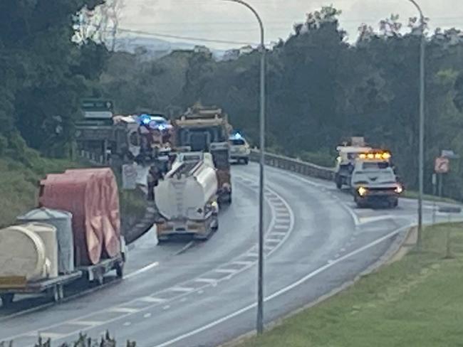 Woman rushed to hospital after being cut from car on highway