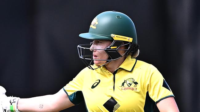 SYDNEY, AUSTRALIA - JANUARY 12: Alyssa Healy of Australia raises her bat to celebrate completing her half-century during game one of the Women's Ashes ODI series between Australia and England at North Sydney Oval on January 12, 2025 in Sydney, Australia. (Photo by Ayush Kumar/Getty Images)