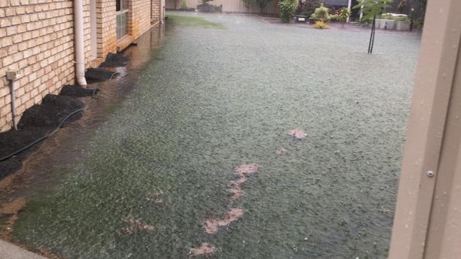 Heavy rain has caused flash flooding in Jacobs Well. Photo: Leanne Hodgkinson