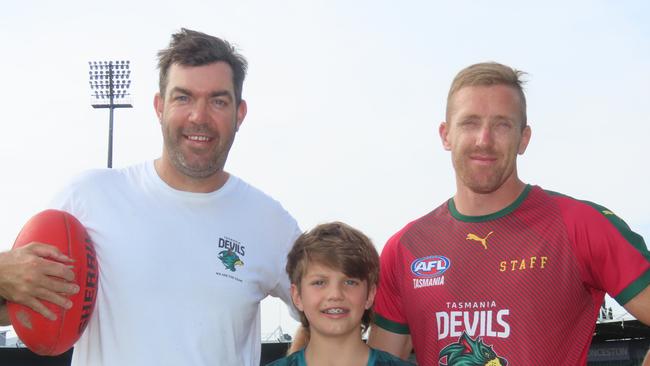 Launceston football identities Will Tatchell and Brad Cox-Goodyer, pictured with Will's son Max, will kick goals for 24 straight hours to raise funds for charity this weekend. Picture: Jon Tuxworth