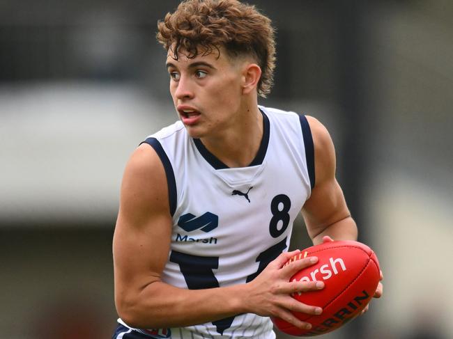 MELBOURNE, AUSTRALIA - June 8: Cody Walker of Vic Country takes possession of the ball during the AFL 2024 Under 16 Boys Championships match between Vic Metro and Vic Country at Trevor Barker Beach Oval on June 08, 2024 in Melbourne, Australia. (Photo by Morgan Hancock/AFL Photos)