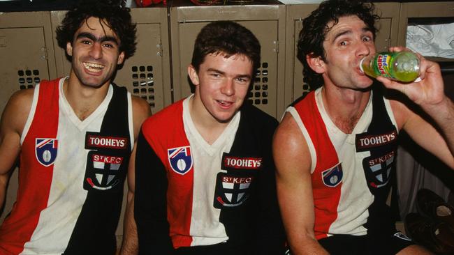 John Georgiou (right), Aussie Jones and Dean Anderson relax in the rooms after a St Kilda victory in 1995.