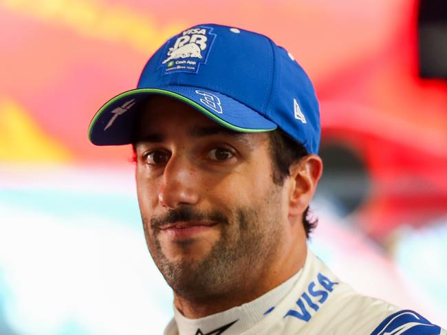 MELBOURNE, AUSTRALIA - MARCH 23: Daniel Ricciardo of Australia and Visa Cash App RB talks to the media during qualifying ahead of the F1 Grand Prix of Australia at Albert Park Circuit on March 23, 2024 in Melbourne, Australia. (Photo by Peter Fox/Getty Images)