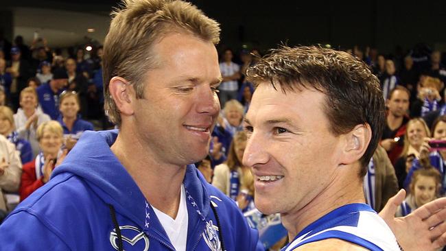 North Melbourne v Adelaide Crows. Etihad Stadium. Brent Harvey hugs Glenn Archer before todays game. Harvey equals Archers Kangaroos games record today