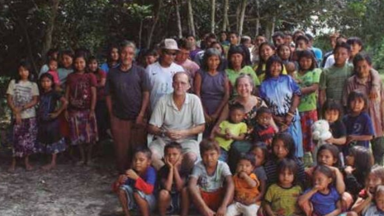 Steve Campbell with his wife Robin surrounded by Jamamadi people in the Southern Amazonas, where they have lived for over fifty years.