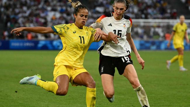 Mary Fowler is marked by Germany's midfielder Jule Brand during the Paris Olympics. Picture: Christophe Simon / AFP