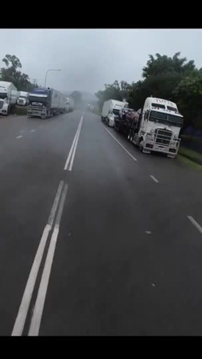 Trucks line up as road still closed