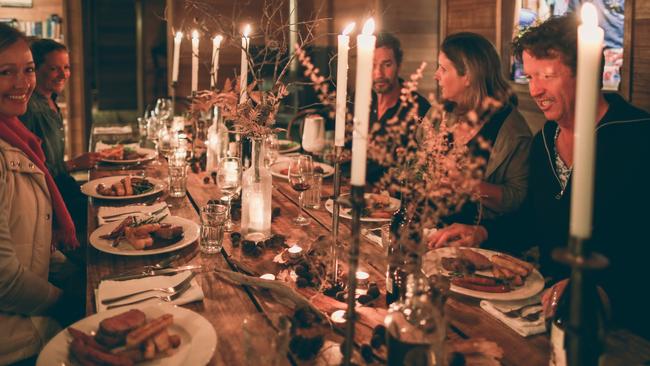 Walkers enjoy a candle-lit dinner at the lodge.