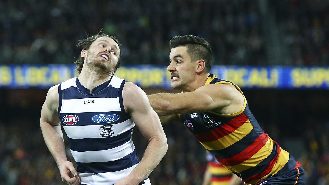 Patrick Dangerfield and Taylor Walker clash at Adelaide Oval. Picture Sarah Reed