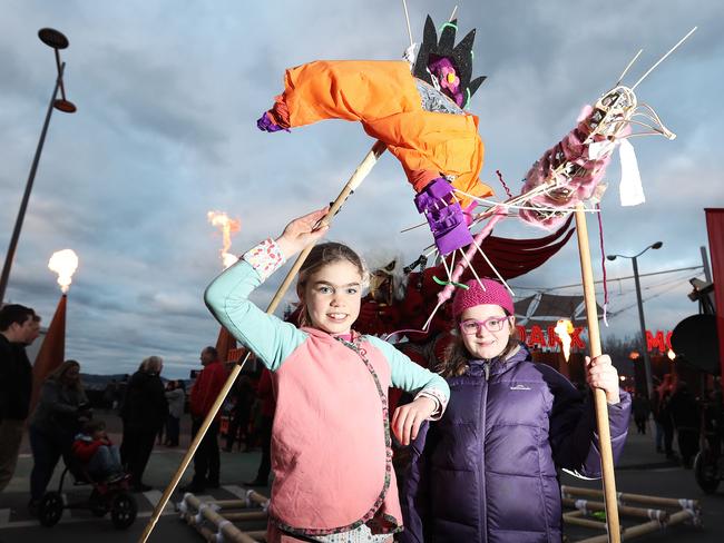 Grade 3 Lansdowne Crescent Primary School students Elka Kuylaars (left) and Frannkie Allocca with their Ogoh-Ogoh birds they made on a school excursion and were participating in the parade. Picture: LUKE BOWDEN