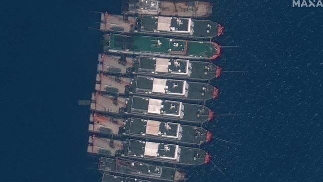 Chinese vessels anchored at the Whitsun Reef in the South China Sea. Picture: Maxar Technologies via AFP.