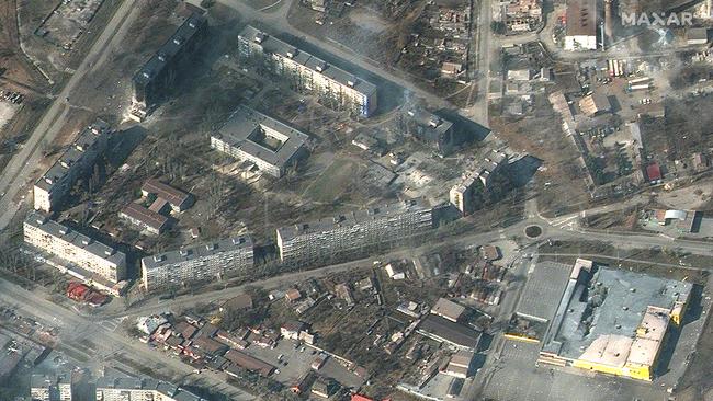 Burning and heavily damaged apartment buildings and stores in Mariupol, southeastern of Ukraine. Picture: Maxar Technologies / AFP