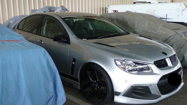 A Holden SUV located in one of the storage units owned by an Adelaide Hills man allegedly involved in dark web drug trafficking and money laundering. Picture: SA Police