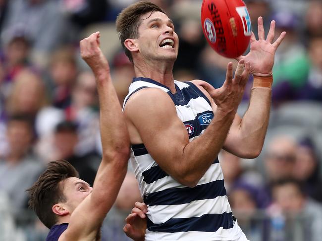 Tom Hawkins marks in front of Ethan Hughes. Picture: AAP