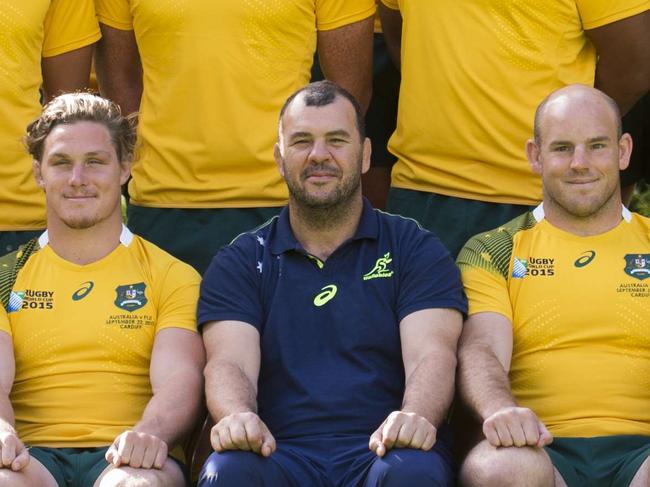 Australia rugby union team pose for a group photograph, Front row, (L-R): Australia's wing Adam Ashley-Cooper, Australia's scrum half Will Genia, Australia's centre Matt Giteau, Australia's flanker Michael Hooper, Australia's head coach Michael Cheika, Australia's hooker and captain Stephen Moore, Australia's fly half Kurtley Beale, Australia's prop Sekope Kepu and Australia's prop James Slipper. Middle row, (L-R): Australia's fly half Bernard Foley, Australia's lock Scott Fardy, Australia's lock Rob Simmons, Australia's lock Kane Douglas, Australia's lock Will Skelton, Australia's lock Dean Mumm, Australia's centre Tevita Kuridrani and Australia's flanker David Pocock. Back row, (L-R): Australia's hooker Tatafu Polota-Nau, Australia's wing Rob Horne, Australia's prop Greg Holmes, Australia's full-back Israel Folau, Australia's prop Scott Sio, Australia's centre Matt Toomua and Australia's scrum half Nick Phipps , winger Rob Horne, prop Greg Holmes, fullback Israel Folau, prop Scott Sio, centre Matt Toomua and scrumhalf Nick Phipps, on September 21, 2015 in Bath, south west England, ahead of their opening Rugby World Cup 2015 match against Fiji on Wednesday. AFP PHOTO / MARTIN BUREAU RESTRICTED TO EDITORIAL USE AFP PHOTO / MARTIN BUREAU