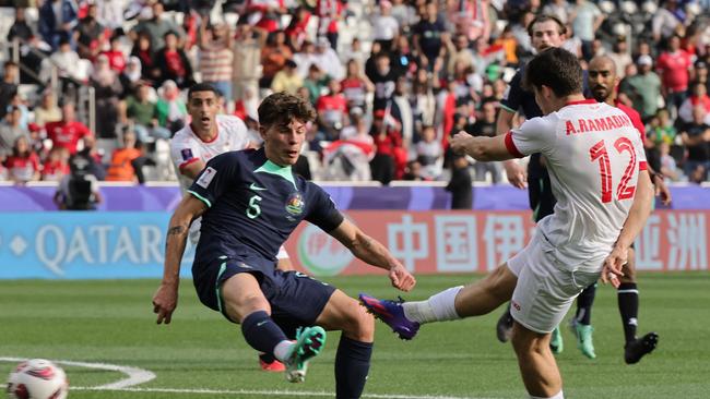 Australia's defender Jordan Bos and Syria's midfielder Ammar Ramadan vie for the ball during the Qatar 2023 AFC Asian Cup Group B match. Picture: Giuseppe Cacace / AFP.