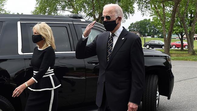 Democratic presidential candidate and former US Vice President Joe Biden salutes veterans while walking with his wife Jill in Delaware this week. Picture: AFP