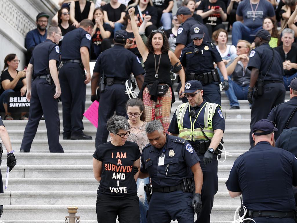 Activists arrested by Capitol Hill Police officers as they protest the confirmation vote of Supreme Court nominee Brett Kavanaugh in Washington. Picture: AP Photo/Alex Brandon