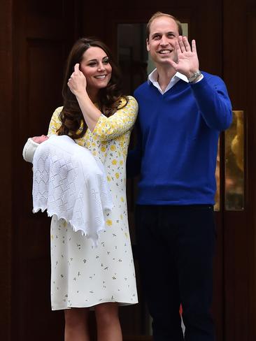 Britain's Prince William, Duke of Cambridge, and his wife Catherine, Duchess of Cambridge as they show their newly-born daughter, their second child, to the media outside the Lindo Wing at St Mary's Hospital in central London, on May 2, 2015. The Duchess of Cambridge was safely delivered of a daughter weighing 8lbs 3oz, Kensington Palace announced. The newly-born Princess of Cambridge is fourth in line to the British throne. AFP PHOTO / BEN STANSALL