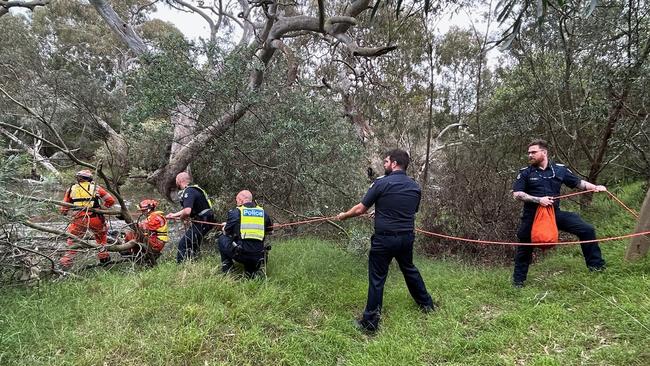 Emergency services work to rescue a 29-year-old woman from the Werribee River on Tuesday. Photo: Victoria Police