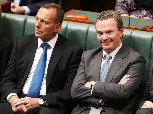 Then Minister for Education and Training Christopher Pyne and Tony Abbott listen to  Opposition leader Bill Shorten's budget reply speech on May 14, 2015.