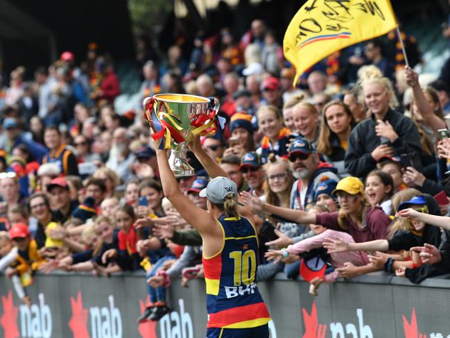 The Crows’ No. 10 holds the 2019 AFLW premiership cup aloft in front of more than 53,000 fans at Adelaide Oval. Picture: AAP