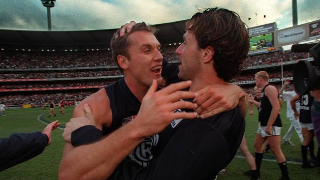 SEPTEMBER 18, 1999 : Anthony Koutifidies (L) & Ang Christon celebrate following 18/09/99 AFL preliminary final Essendon v Carlton at MCG. Pic Richard Cisar-Wright.Australian Rules