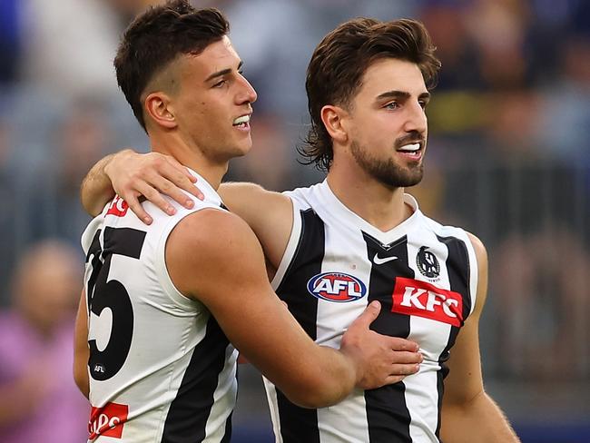 PERTH, AUSTRALIA - JUNE 03: Nick Daicos and Josh Daicos of the Magpies celebrate a goal during the round 12 AFL match between West Coast Eagles and Collingwood Magpies at Optus Stadium, on June 03, 2023, in Perth, Australia. (Photo by Paul Kane/Getty Images)