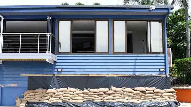 Sandbags placed under a restaurant next to the Rock Pool along the Strand in preparation for Cyclone Debbie. Picture: Ian Hitchcock/Getty Images