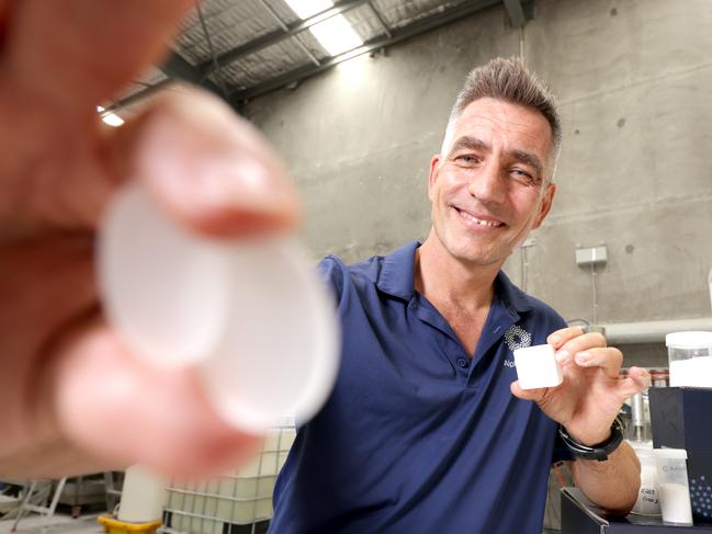 Rimas Kairaitis, the Managing Director Alpha HPA, holding Ultra-High Purity Alumina Tablets and Ultra Sapphire Wafers, Murarrie, on Monday 12th February 2024 - Photo Steve Pohlner