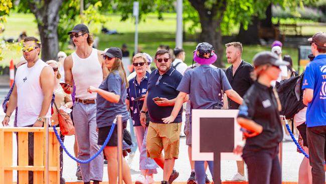 The first people come through the gates of the Taste of Summer at PW1 on Hobart waterfront. Picture: Linda Higginson