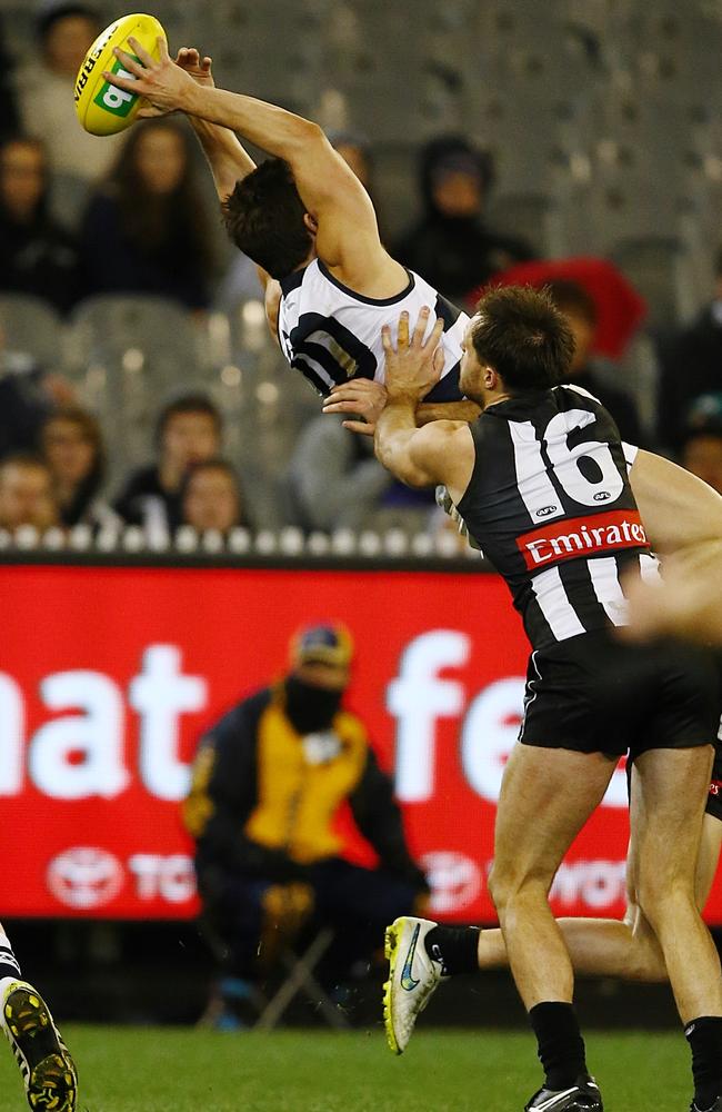 Daniel Menzel marks over Tom Langdon (out of screen) and Nathan Brown. Picture: Wayne Ludbey