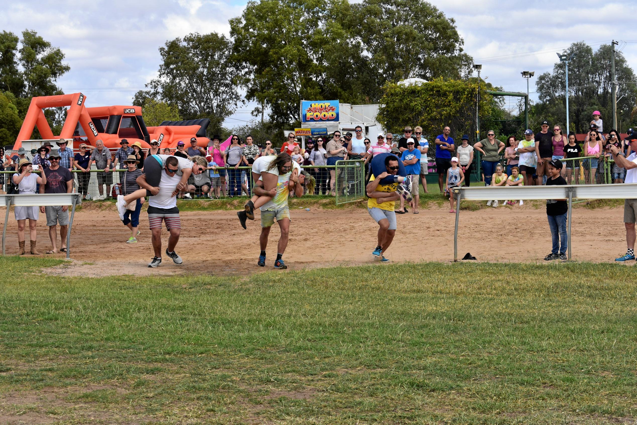 the final of the wife carrying race in action