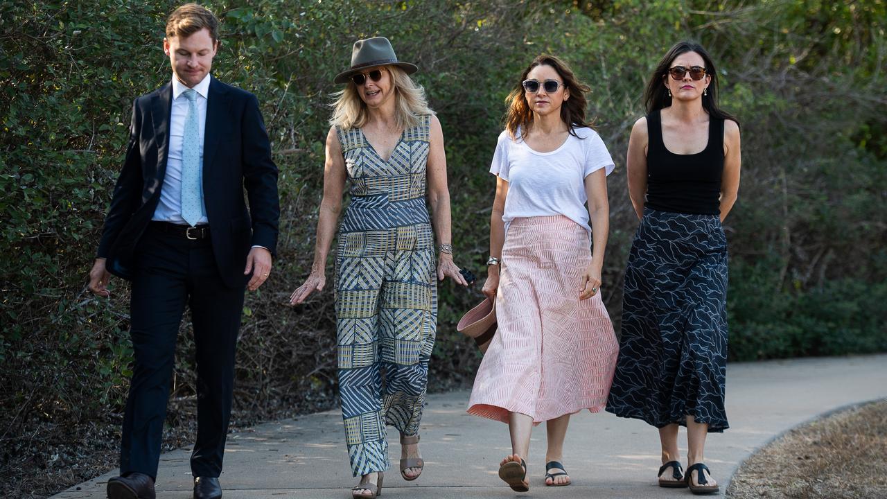 The family of Ngeygo Ragurrk's lawyer James Lowrey, left, with coroner Elisabeth Armitage, counsel assisting Peggy Dwyer and Maria Walz take part in a ceremony at Mindil Beach, where on December 23 2019 the 40-year-old woman was killed by her partner Garsek Nawirridj. Picture: Pema Tamang Pakhrin