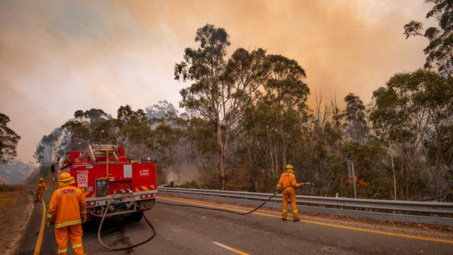 CFA tackle spot fires along the Great Alpine Road just outside Omeo. The fire was burning in thick alpine forest. Picture: Jason Edwards