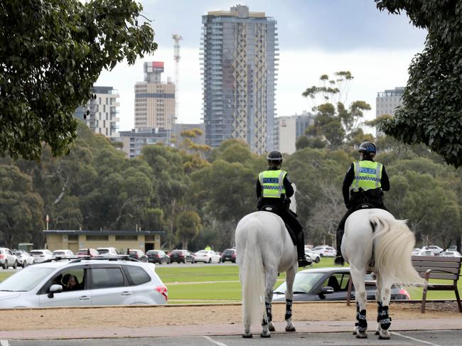 Covid Testing Facitities - Police watch cars lined up heading towards Victoria Park testing station. 21 July 2021. Picture Dean Martin