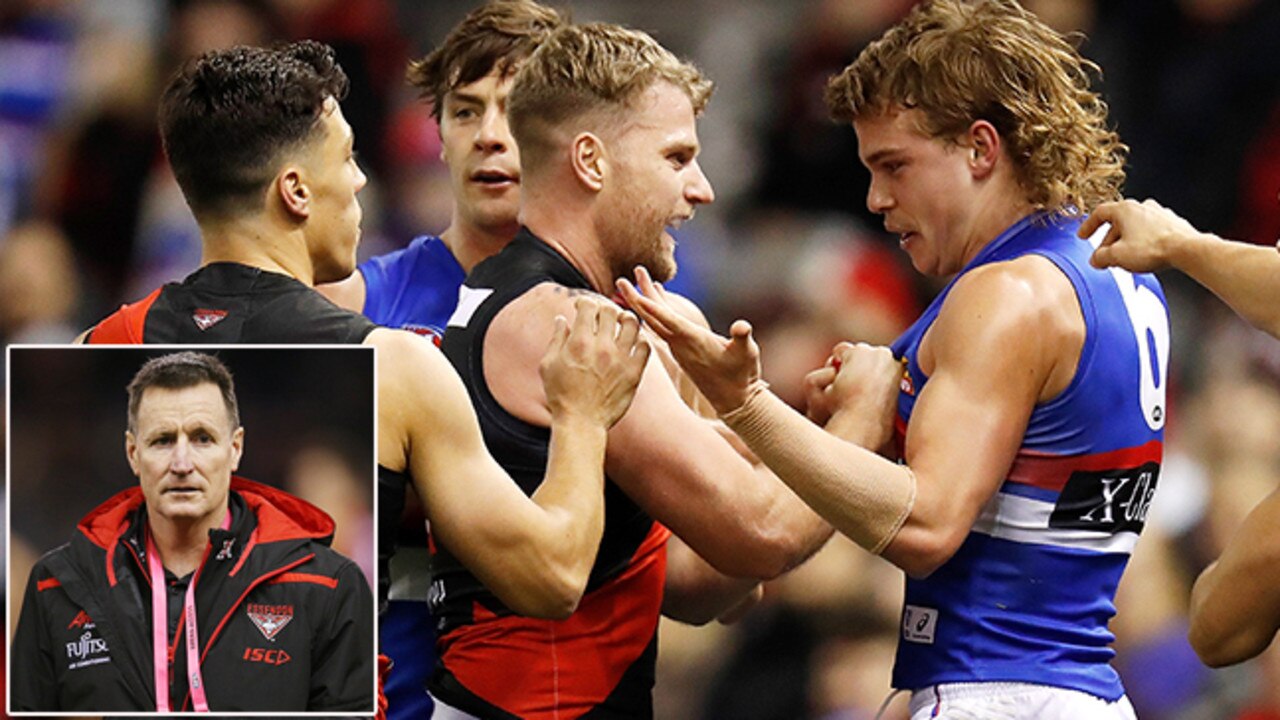 MELBOURNE, AUSTRALIA - AUGUST 10: Jake Stringer of the Bombers and Bailey Smith of the Bulldogs exchange words during the 2019 AFL round 21 match between the Essendon Bombers and the Western Bulldogs at Marvel Stadium on August 10, 2019 in Melbourne, Australia. (Photo by Michael Willson/AFL Photos via Getty Images)