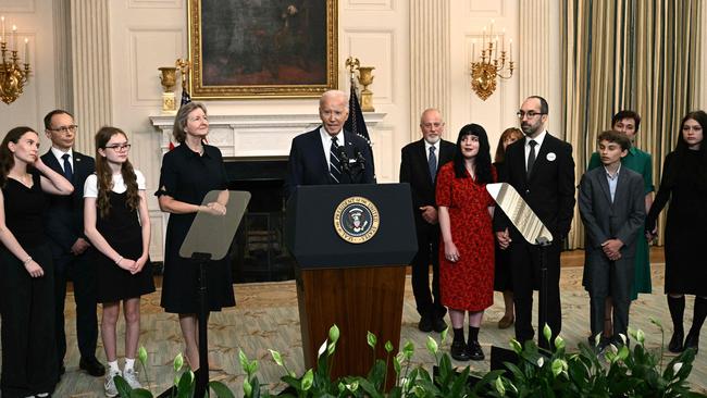 US President Joe Biden, standing alongside family members of the freed prisoners, speaks about the prisoner exchange with Russia, in the State Dining Room of the White House. Picture: AFP.