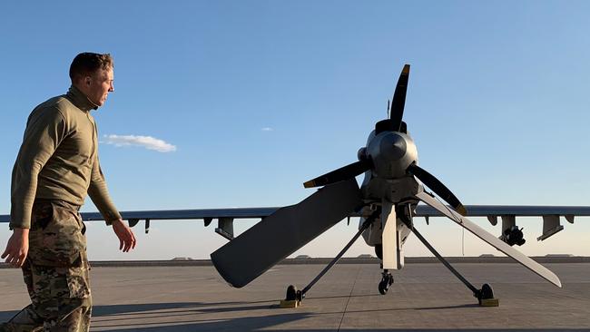 A US soldier walking past a drone at the Ain al-Asad air base in the western Iraqi province of Anbar. Photo: AFP